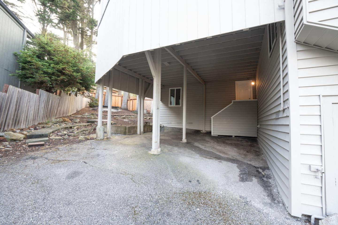 301 Channing Way Pacifica, CA 94044 - Photo 53 of 68 a view of a house with a yard and garage