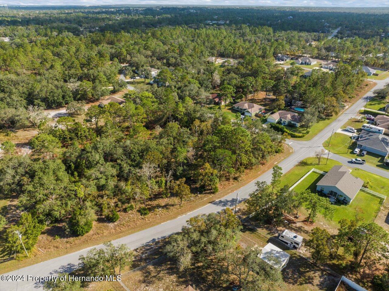 12078 Lark Sparrow Road Brooksville, FL 34614 - Photo 19 of 20 a view of a lake with a yard