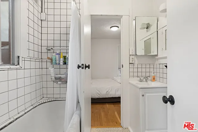a bathroom with a bathtub and shower