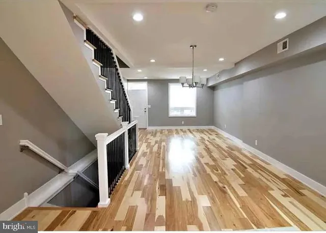 a view of entryway and kitchen