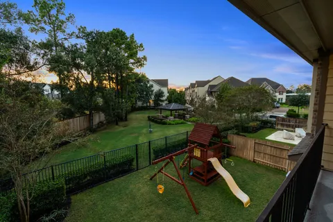a view of a chairs in a backyard