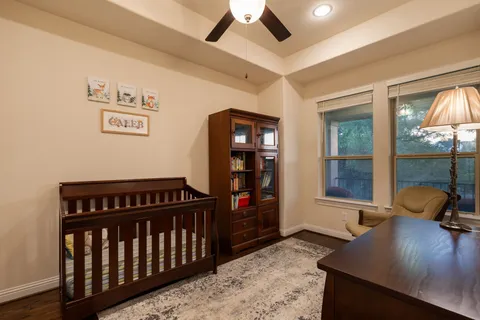 a view of a hallway to a livingroom with furniture