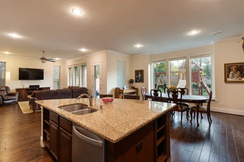 a kitchen with counter and chairs