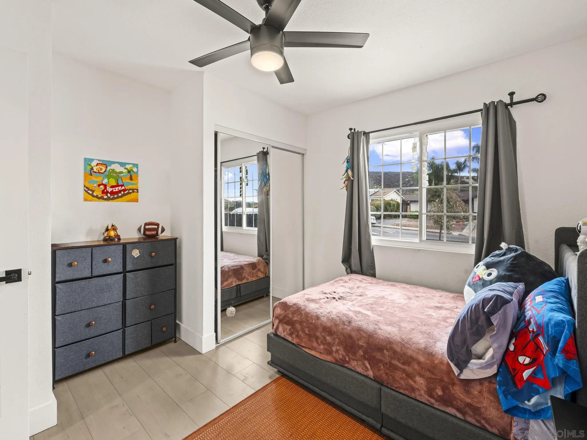 10252 Santana Street Santee, CA 92071 - Photo 9 of 21 a bedroom with a bed and a window