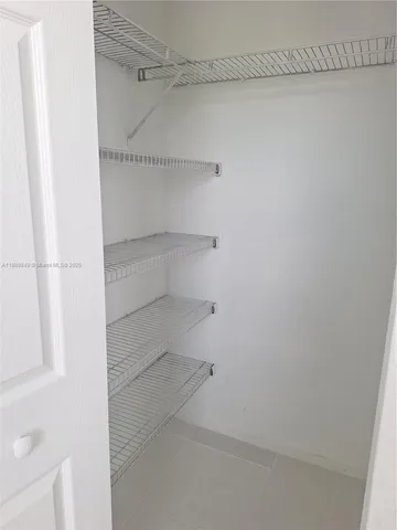 a bath tub sitting next to a shower