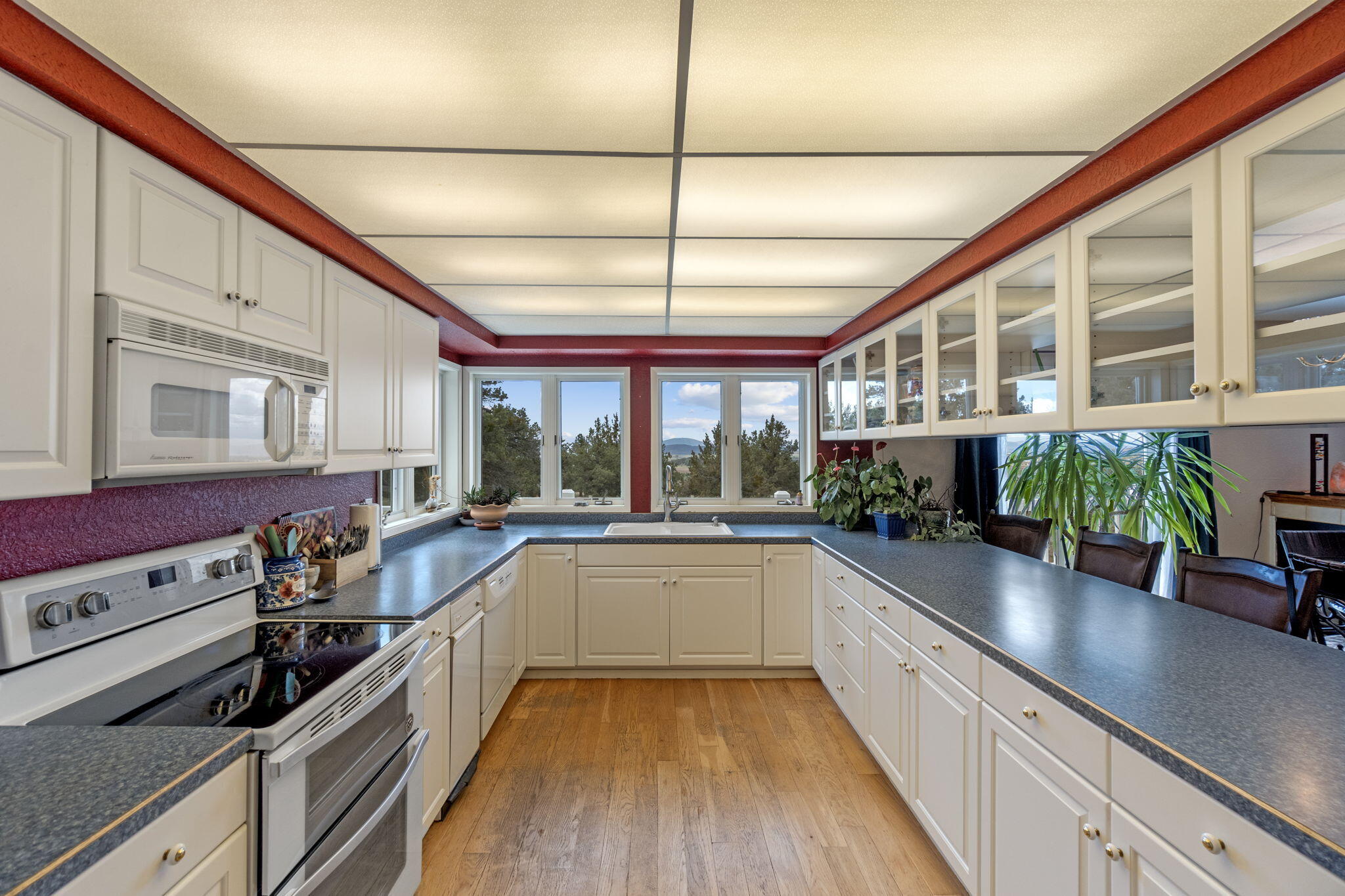 17722 Pope Road Merrill, OR 97633 - Photo 13 of 61 a large kitchen with a large window and stainless steel appliances
