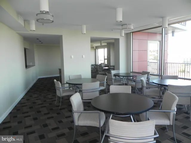 a view of a dining room with furniture and window