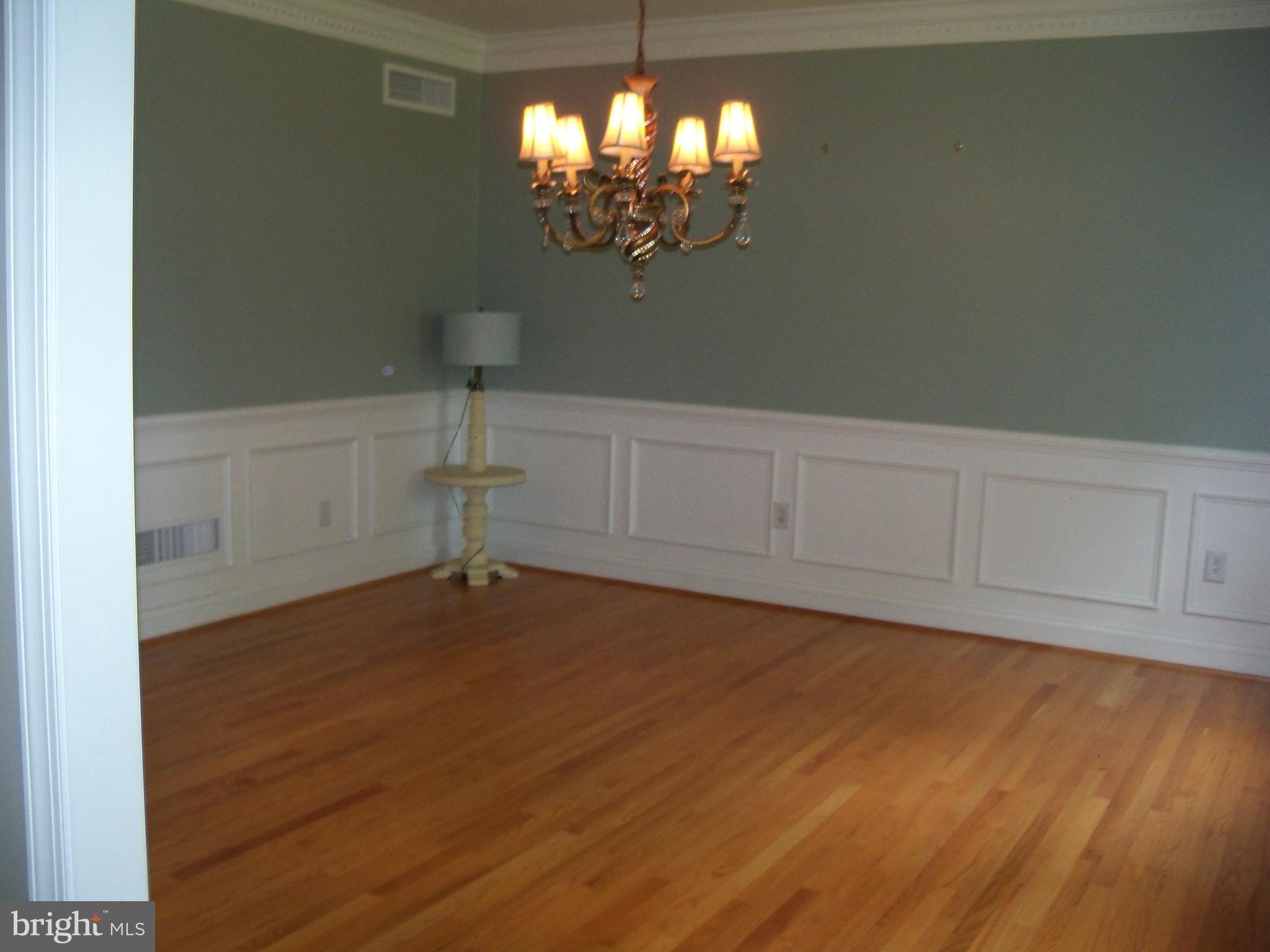 3028 Shepperd Road Monkton, MD 21111 - Photo 13 of 23 a view of a room with wooden floor and chandelier