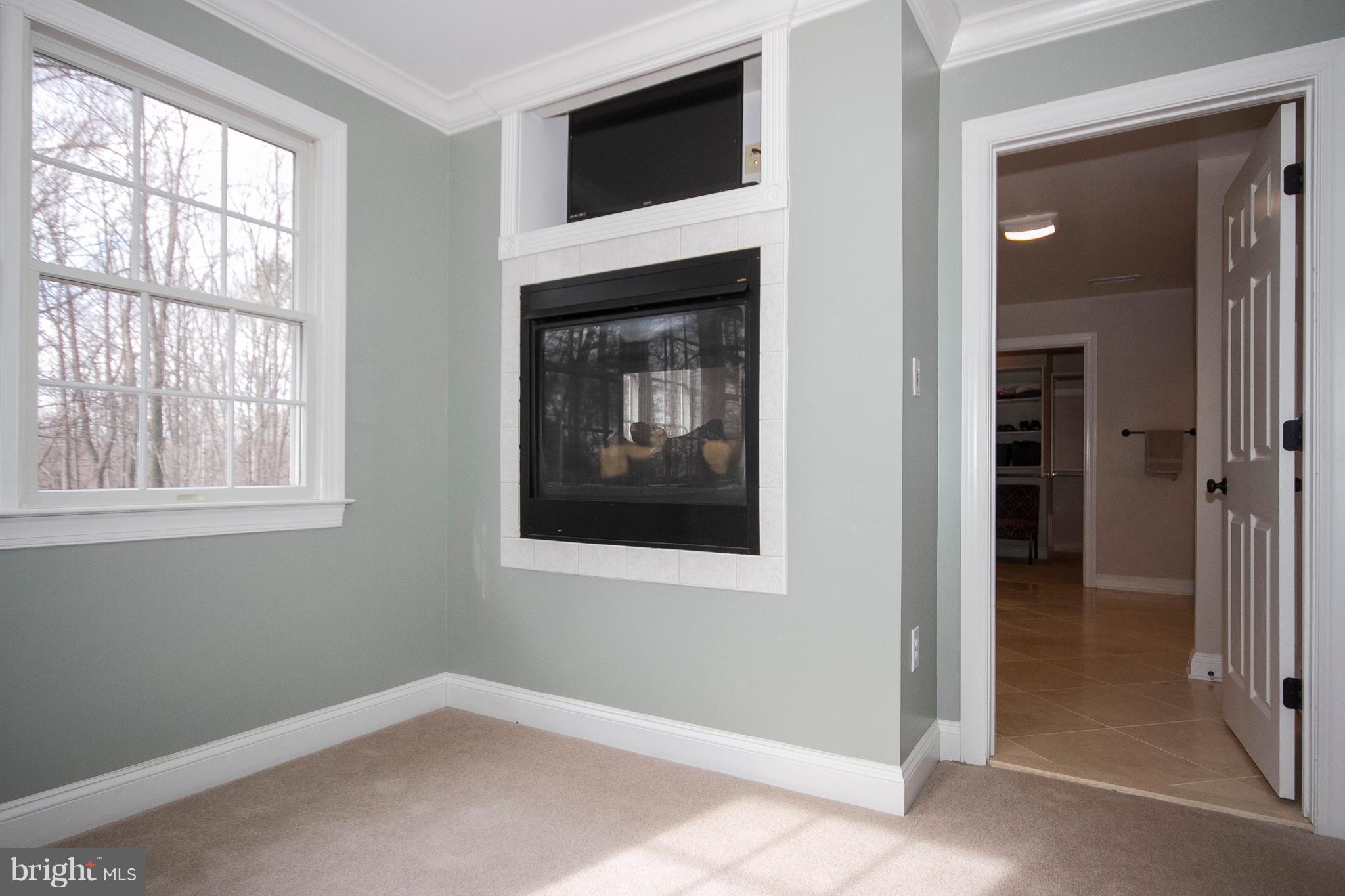 3028 Shepperd Road Monkton, MD 21111 - Photo 17 of 23 an empty room with windows and fireplace