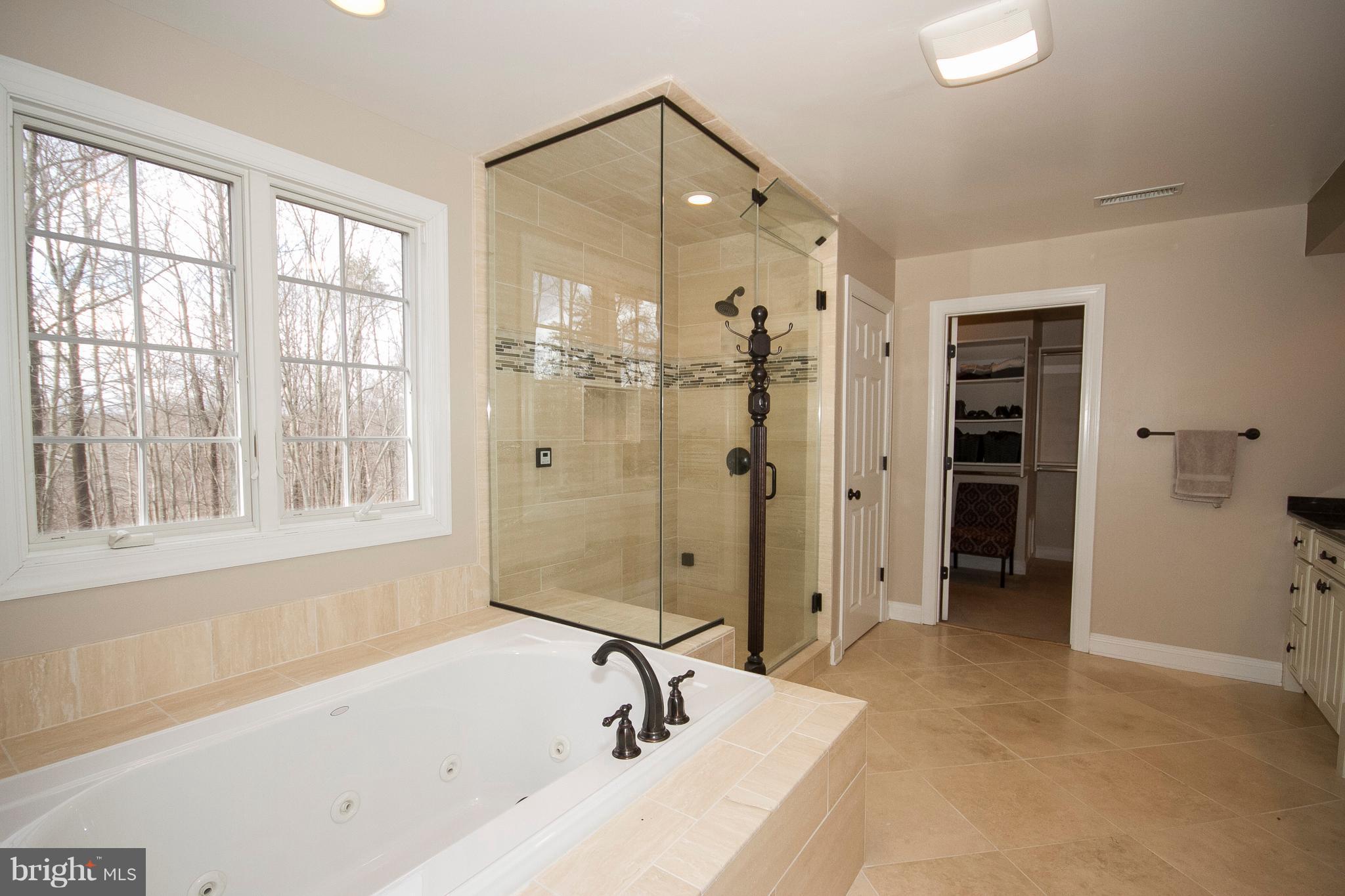 3028 Shepperd Road Monkton, MD 21111 - Photo 18 of 23 a bathroom with a tub a sink and shower