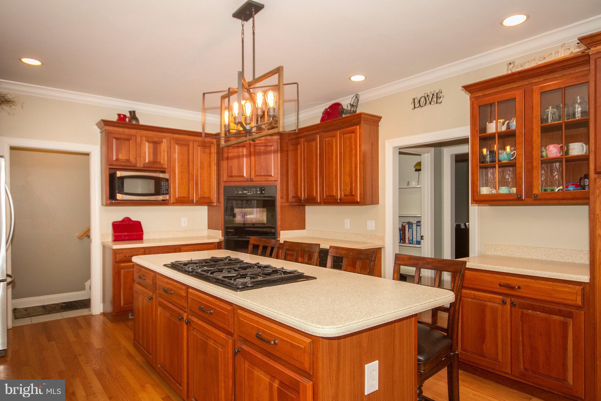 3028 Shepperd Road Monkton, MD 21111 - Photo 8 of 23 a kitchen that has a stove and a table