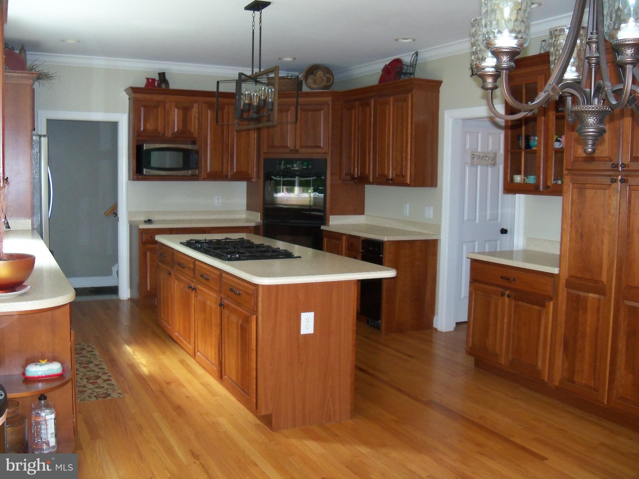 3028 Shepperd Road Monkton, MD 21111 - Photo 9 of 23 a kitchen with stainless steel appliances granite countertop a stove a sink dishwasher and a microwave oven with cabinets