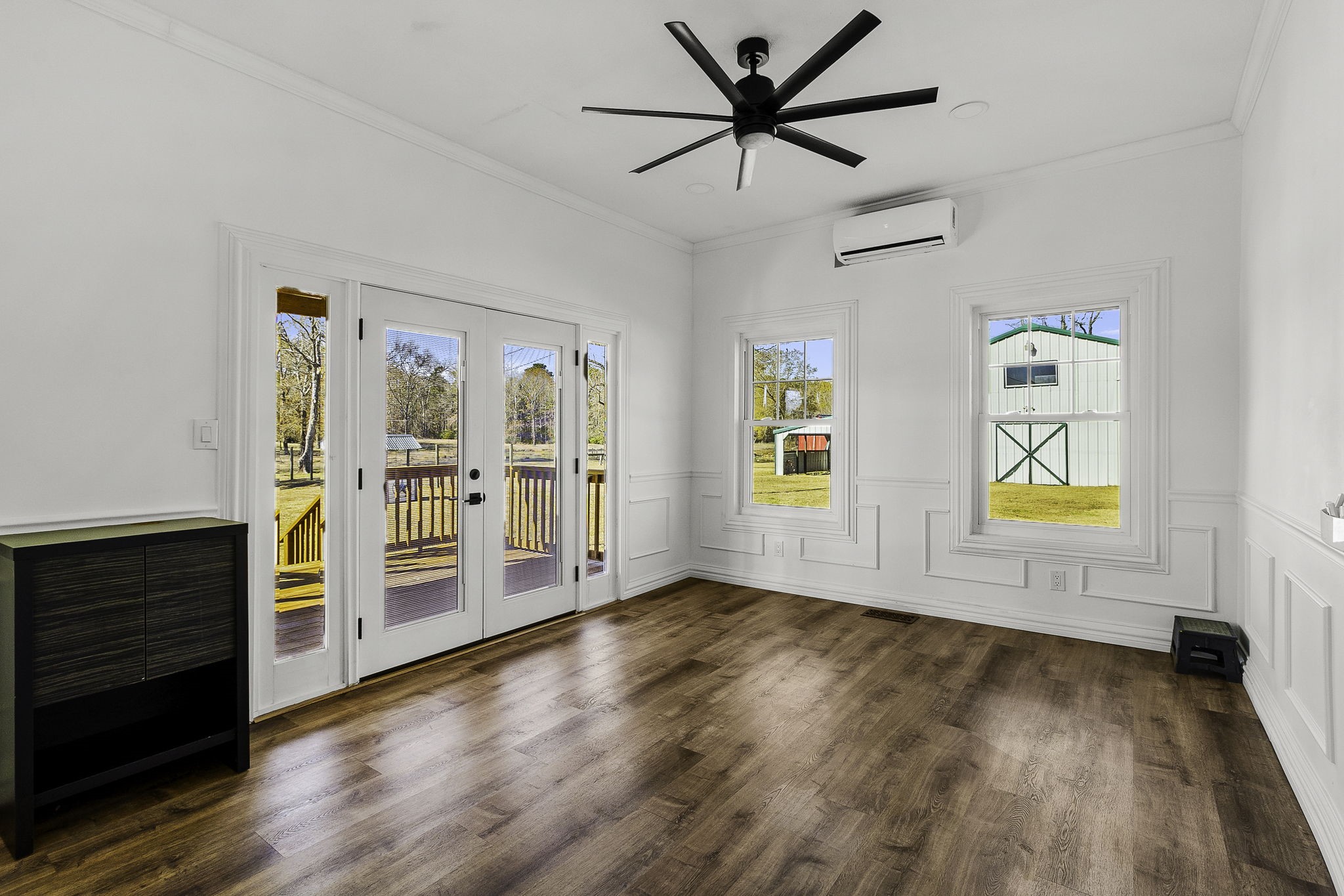 500 Highway 156 Point Blank, TX 77364 - Photo 19 of 50 wooden floor in an empty room with a window and wooden floor