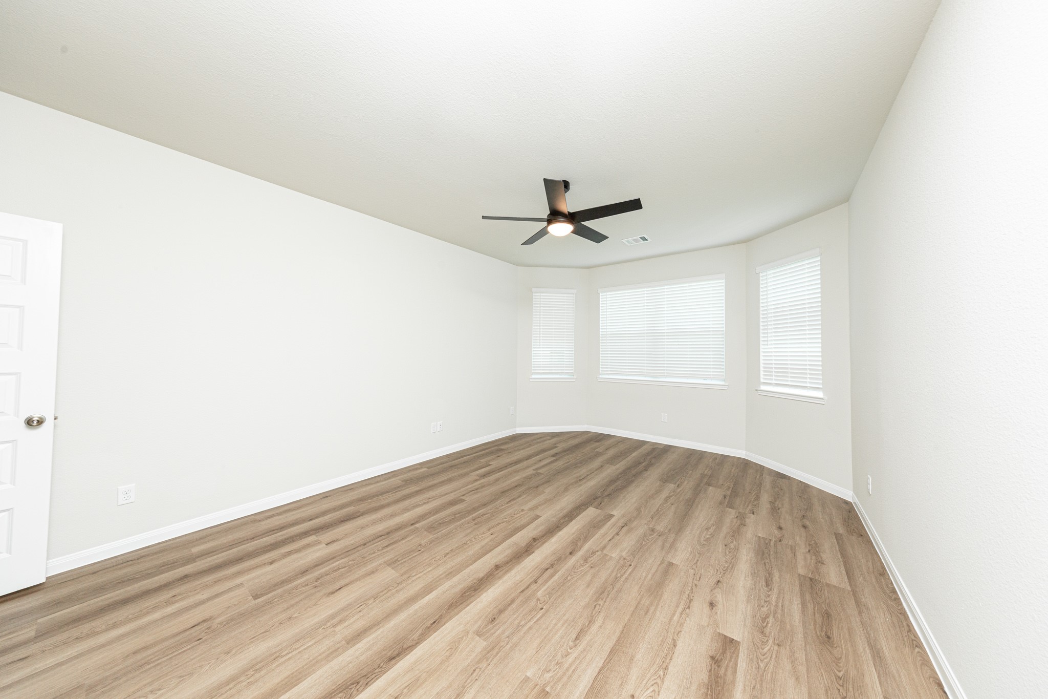 13651 Kit Run Splendora, TX 77372 - Photo 7 of 27 a view of empty room with wooden floor