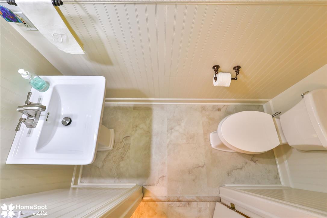 4191 Walter Road Bethlehem, PA 18020 - Photo 3 of 23 A well-appointed lavatory featuring beadboard paneling and durable flooring for daily convenience.