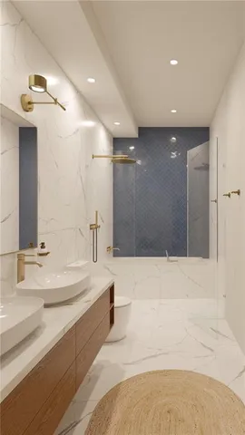 a spacious bathroom with a bathtub sink and mirror