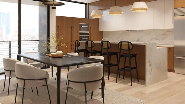a view of a dining room with furniture window and wooden floor