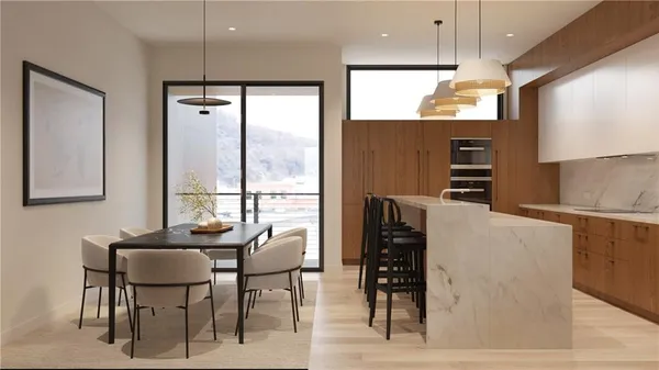 a kitchen with stainless steel appliances kitchen island granite countertop a refrigerator and a stove top oven