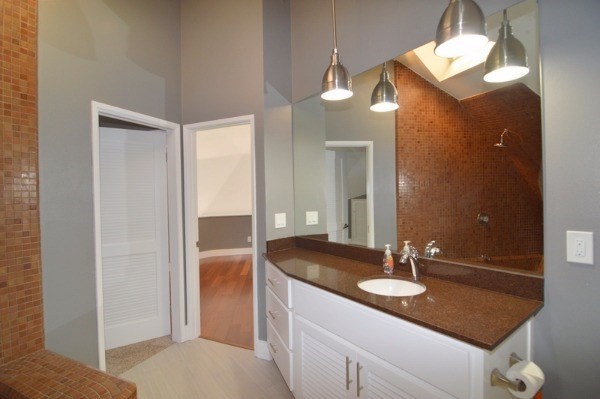 4624 Kuli Road Kalaheo, HI 96741 - Photo 15 of 25 a bathroom with a sink and a mirror