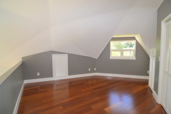 4624 Kuli Road Kalaheo, HI 96741 - Photo 18 of 25 a view of an empty room with wooden floor and a window