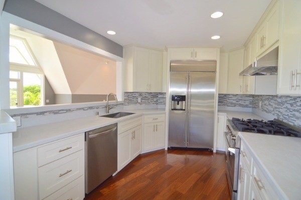 4624 Kuli Road Kalaheo, HI 96741 - Photo 2 of 25 a kitchen with a sink appliances and cabinets