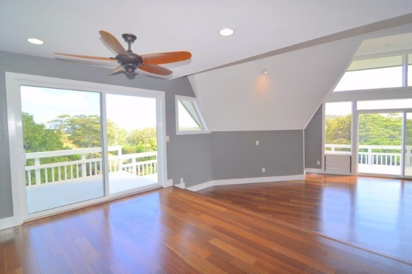 4624 Kuli Road Kalaheo, HI 96741 - Photo 7 of 25 a view of an empty room with wooden floor and a window