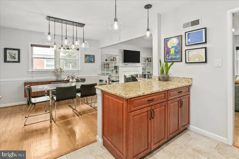 a kitchen with a stove a sink and a refrigerator