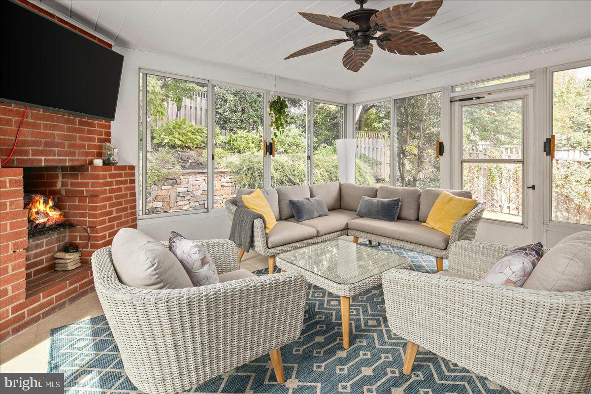 5913 4th Road North Arlington, VA 22203 - Photo 18 of 45 a living room with furniture a flat screen tv and a large window