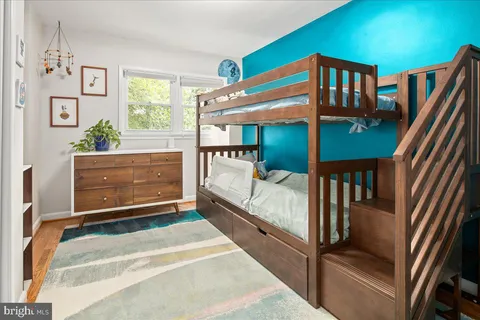 a view of staircase with furniture and a window