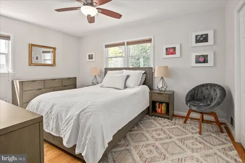 a bedroom with bed and a window