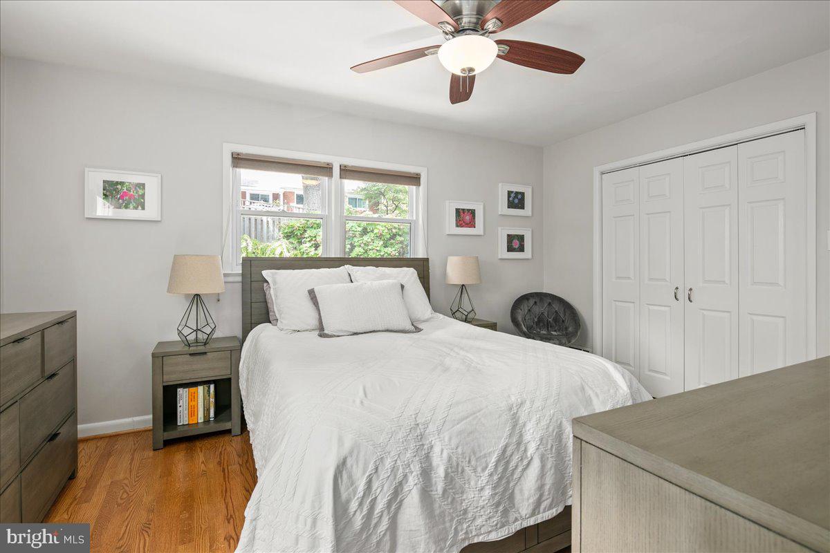 5913 4th Road North Arlington, VA 22203 - Photo 27 of 45 a bed room with a bed and a chandelier
