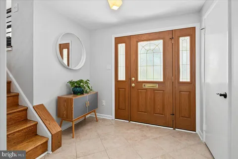 a view of an entryway with wooden floor