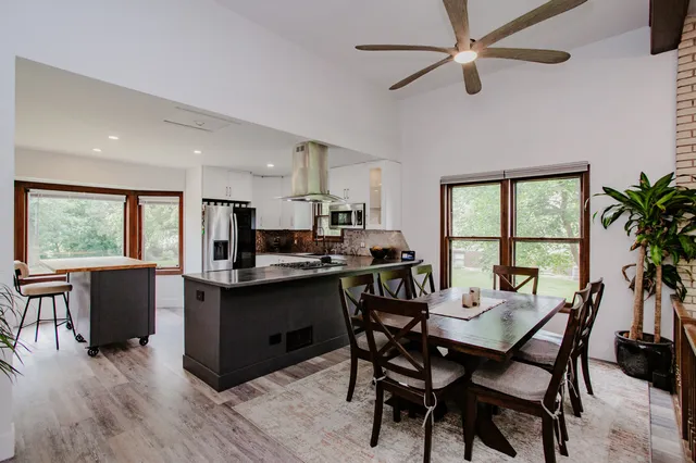 a view of a dining room with furniture window and outside view