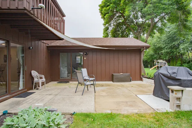 a patio with table and chairs
