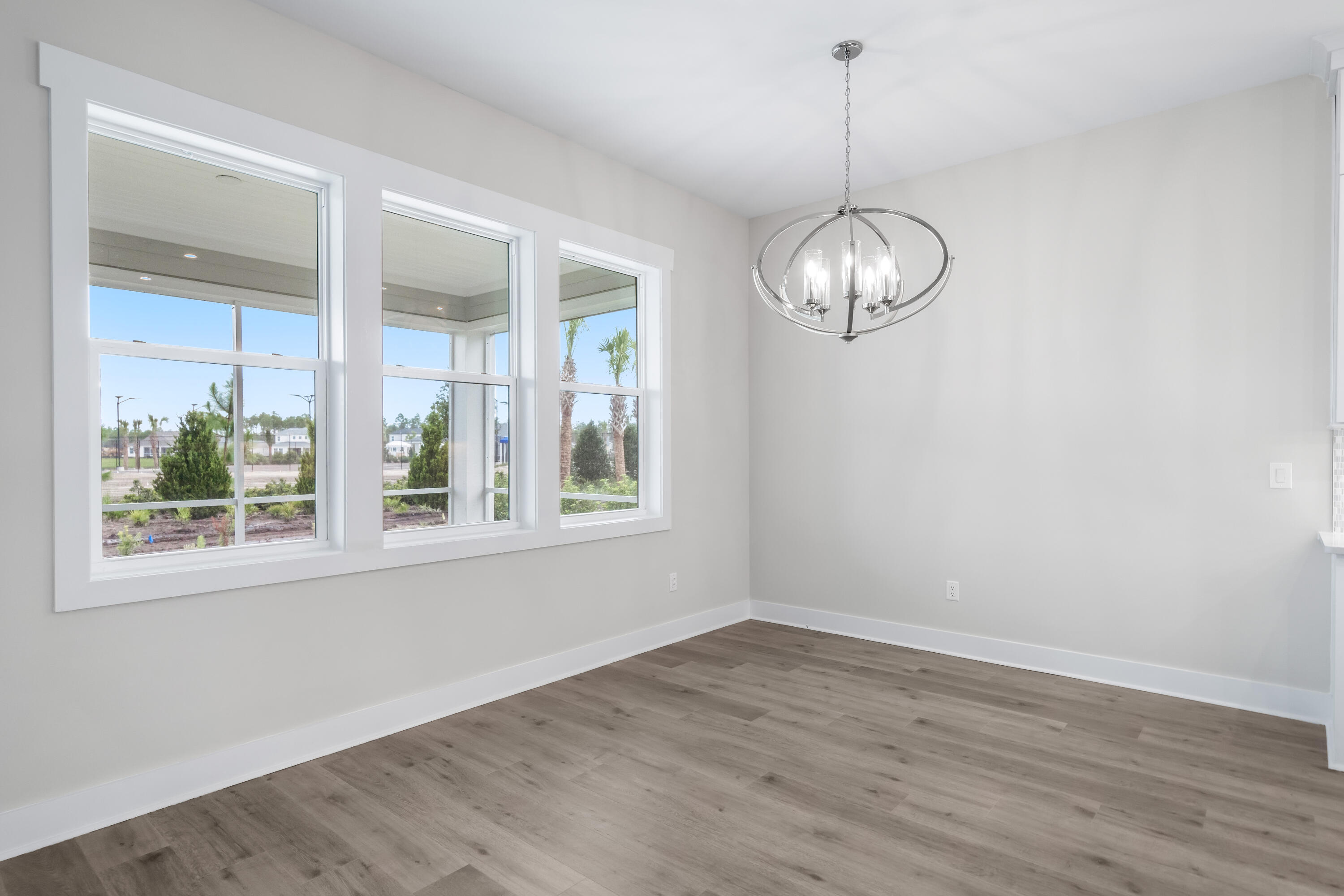 30 River Rise Way Inlet Beach Inlet Beach, FL 32461 - Photo 15 of 61 a view of a room with wooden floor chandelier and windows