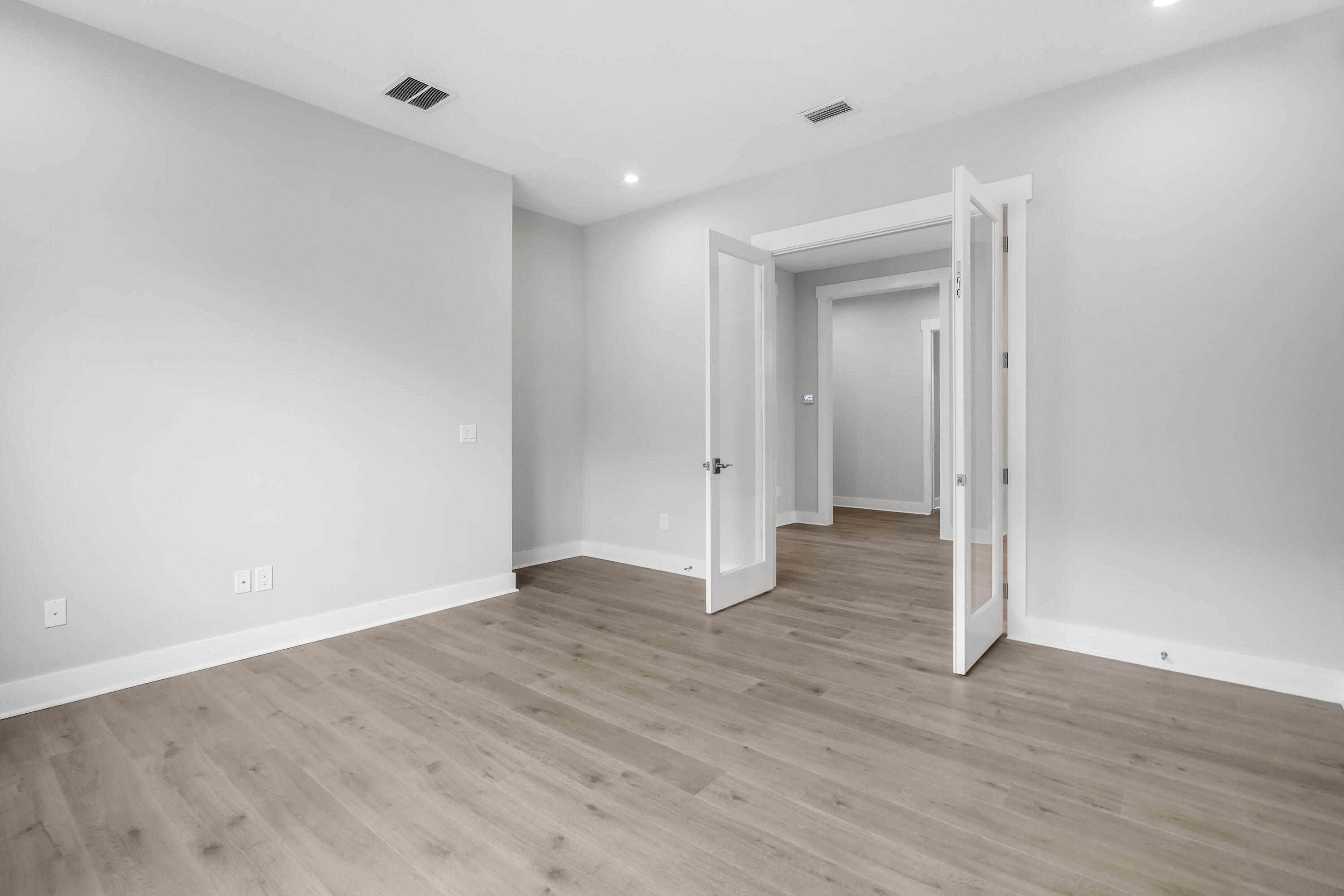 30 River Rise Way Inlet Beach Inlet Beach, FL 32461 - Photo 24 of 61 a view of an empty room with wooden floor