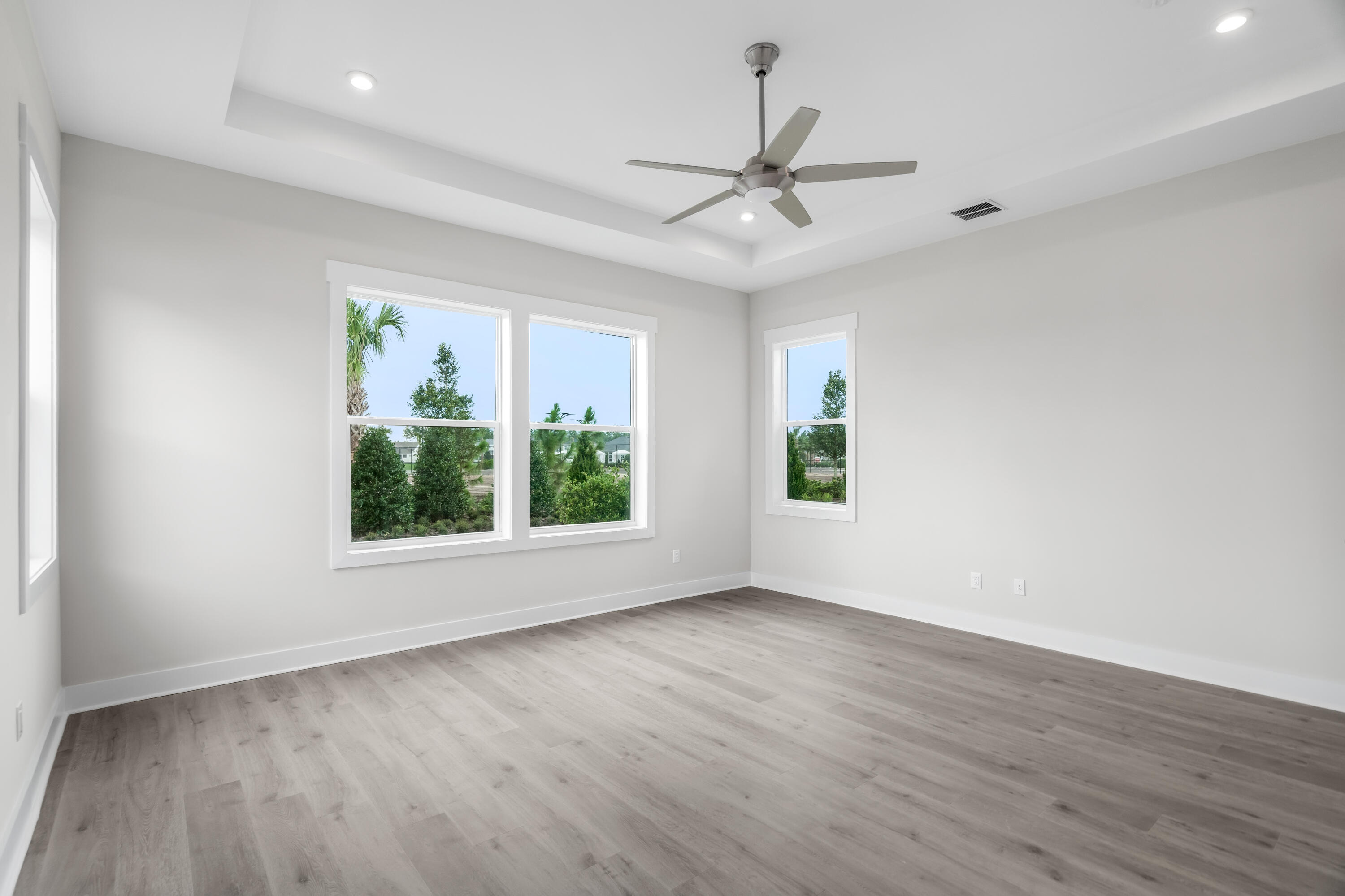 30 River Rise Way Inlet Beach Inlet Beach, FL 32461 - Photo 38 of 61 an empty room with wooden floor fan and windows