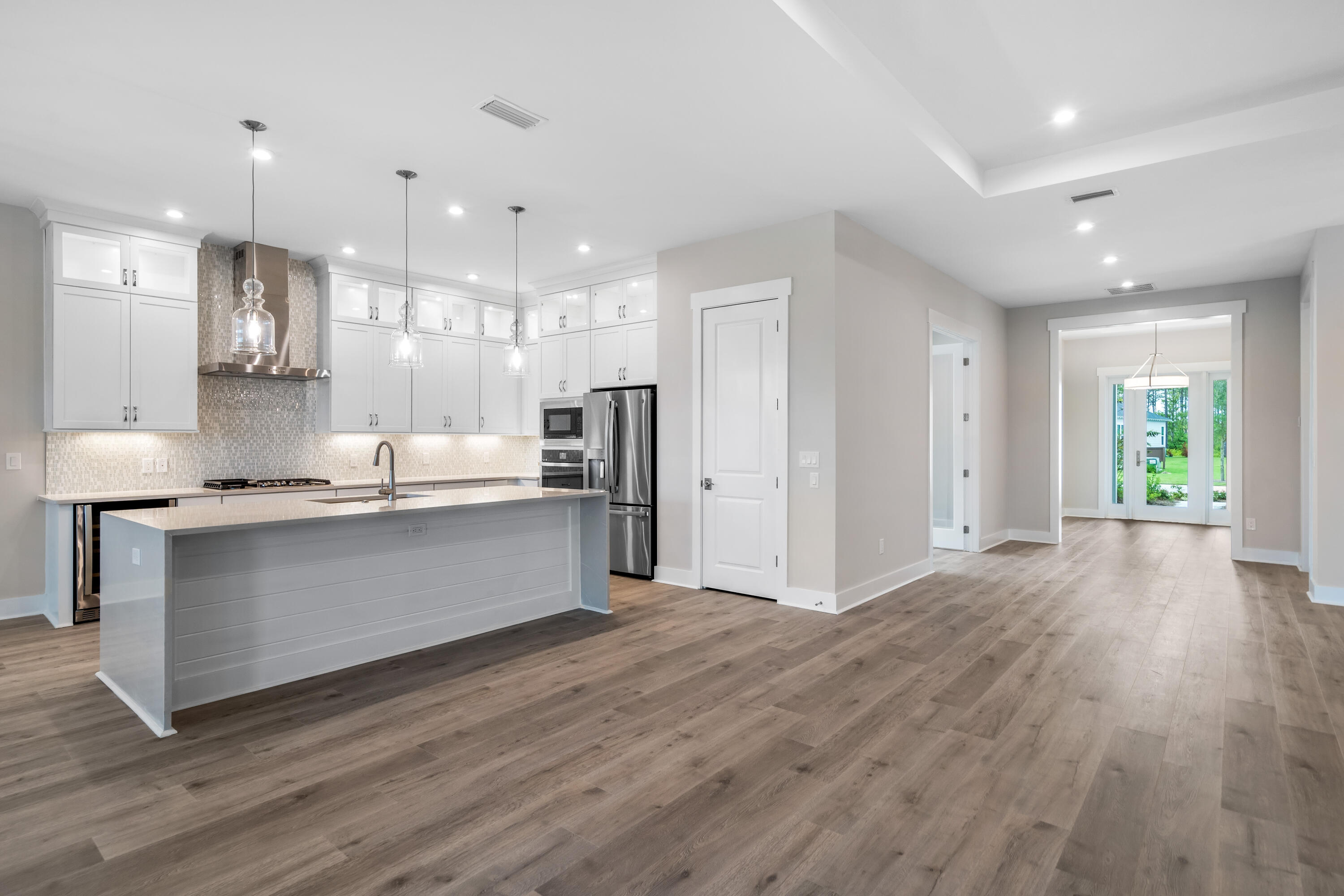 30 River Rise Way Inlet Beach Inlet Beach, FL 32461 - Photo 8 of 61 a large kitchen with stainless steel appliances kitchen island a large counter top and wooden floors