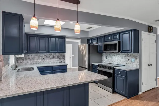 a view of an empty room and wooden floor