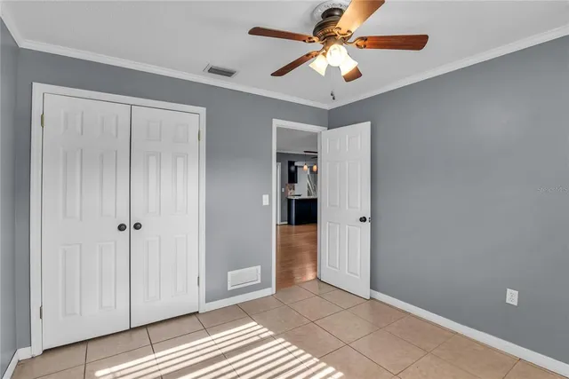 an aerial view of a house with swimming pool and outdoor seating