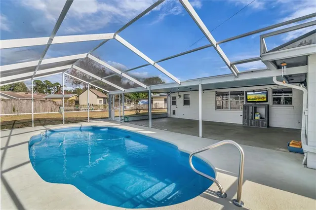 a view of a pathway both side of building with yard