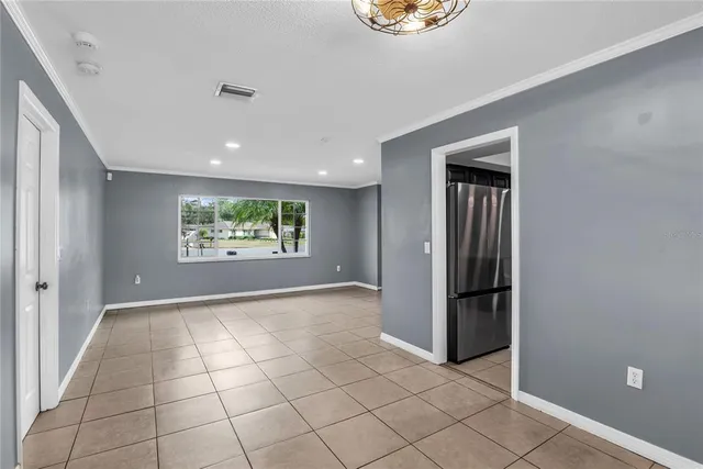 a kitchen with stainless steel appliances granite countertop a sink a stove a refrigerator and cabinets