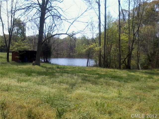5879 Alexander Road Concord, NC 28027 - Photo 6 of 7 a view of backyard with green space