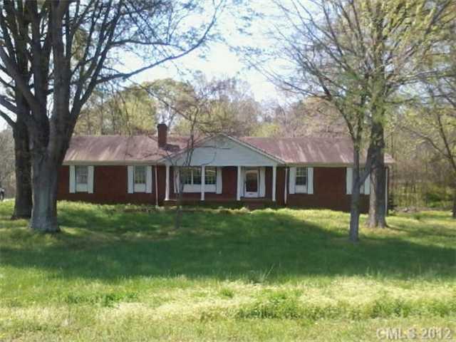 5879 Alexander Road Concord, NC 28027 - Photo 7 of 7 a front view of a house with garden