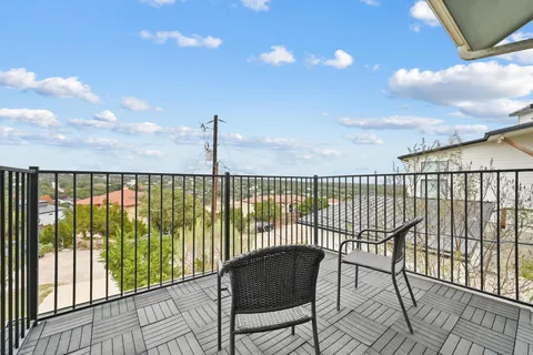 a view of balcony with furniture
