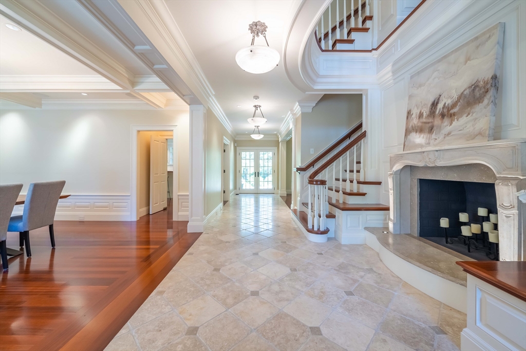 197 Grant Street Lexington, MA 02420 - Photo 4 of 42 a view of an entryway with wooden floor and a chandelier