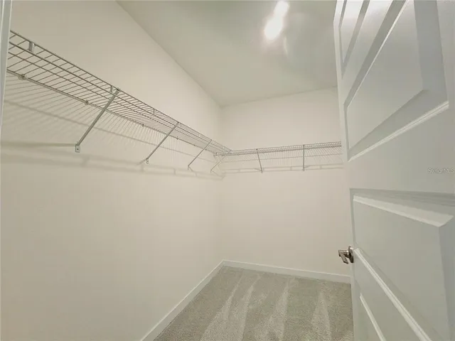 a view of a room with racks on the wall