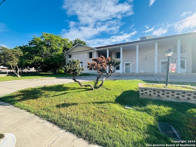 811 Jackson Keller Road, Unit 8 San Antonio, TX 78216 - Photo 3 of 19 a view of a house with swimming pool and a yard
