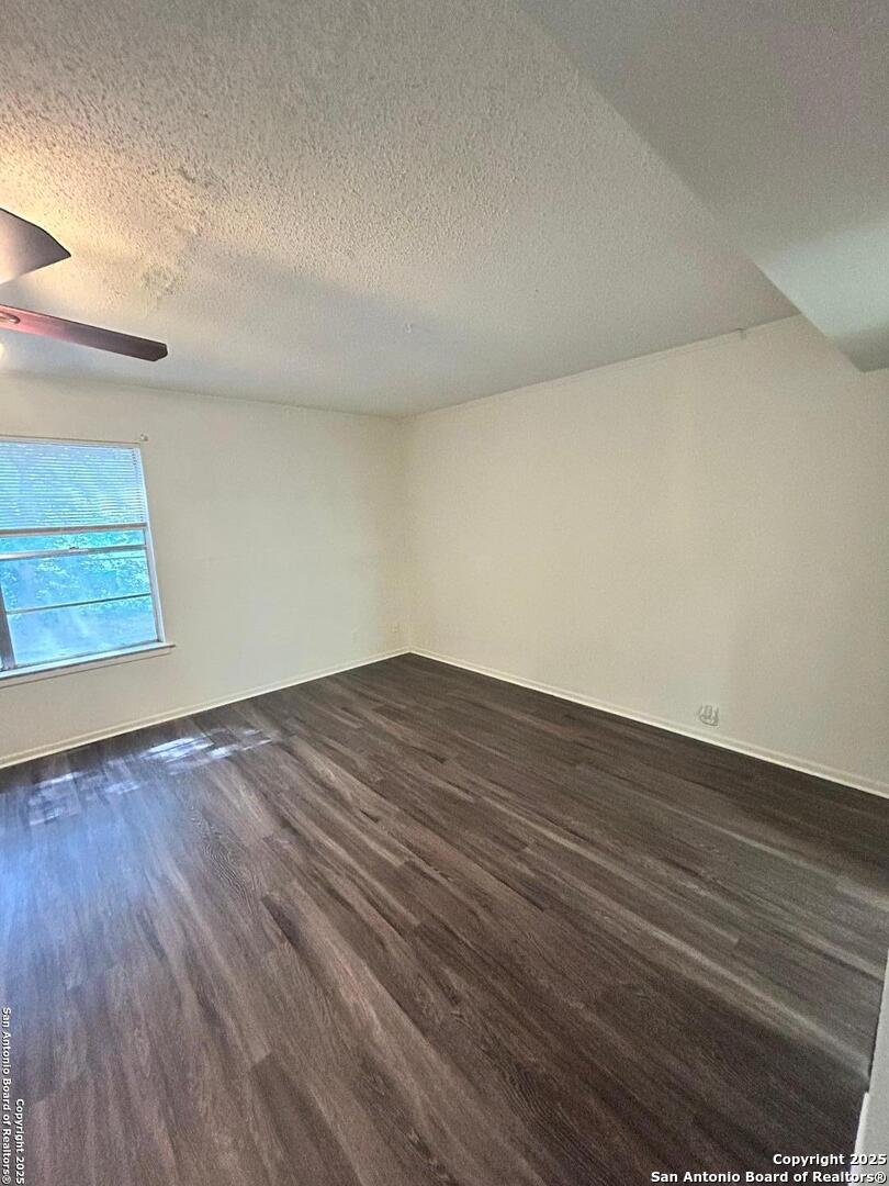 811 Jackson Keller Road, Unit 8 San Antonio, TX 78216 - Photo 8 of 19 a view of room with wooden floor