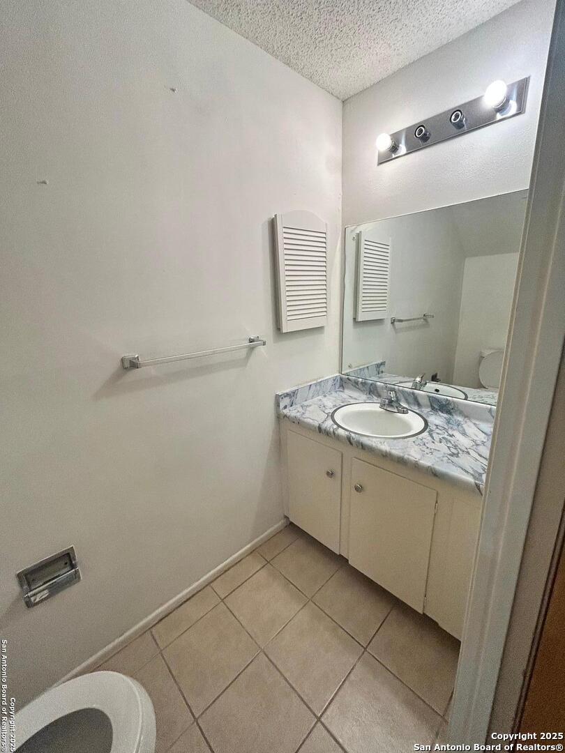 811 Jackson Keller Road, Unit 8 San Antonio, TX 78216 - Photo 9 of 19 a bathroom with a sink and a mirror